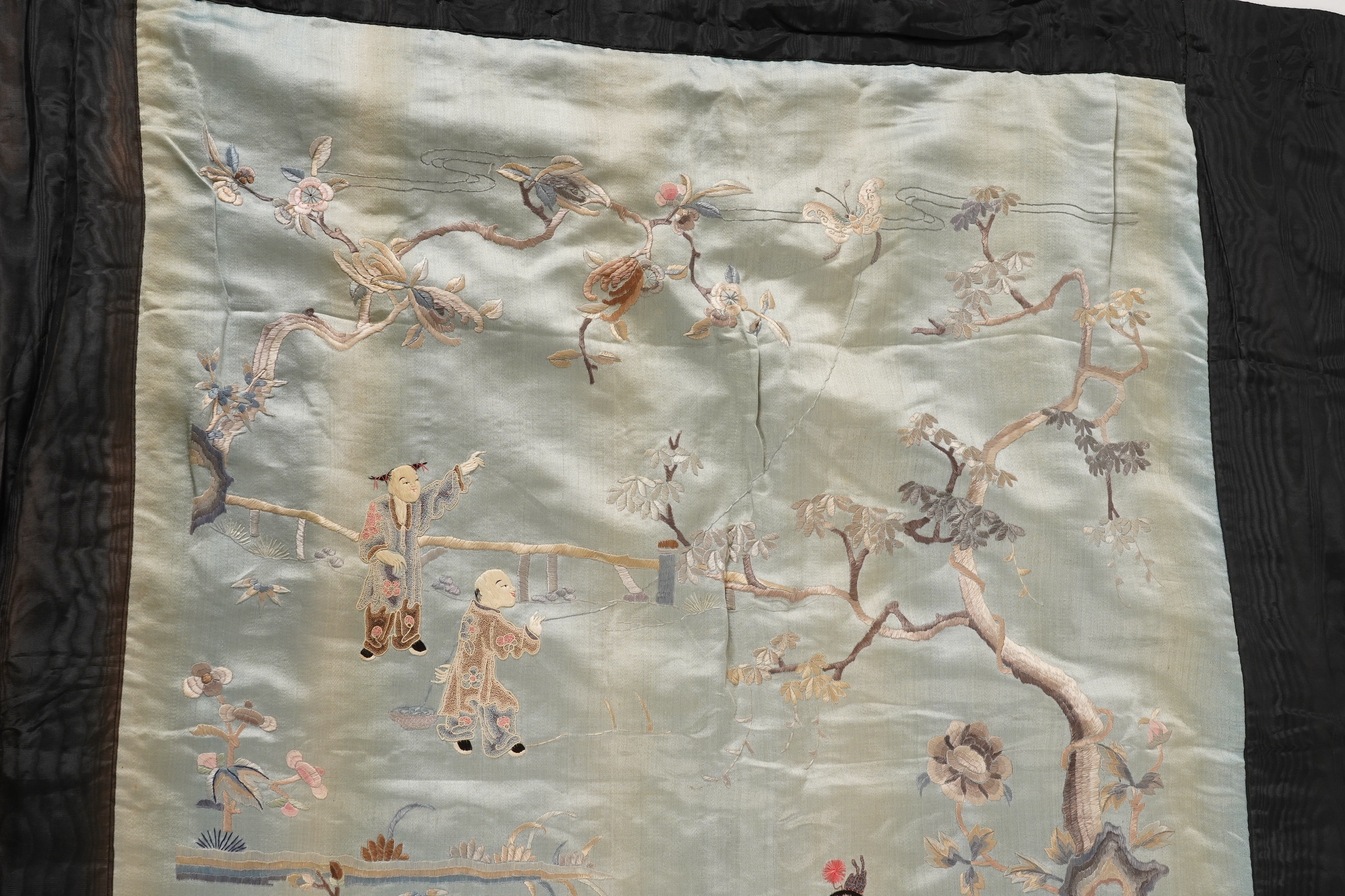 A Chinese embroidered silk ‘dragon dance’ panel, 18th/19th century